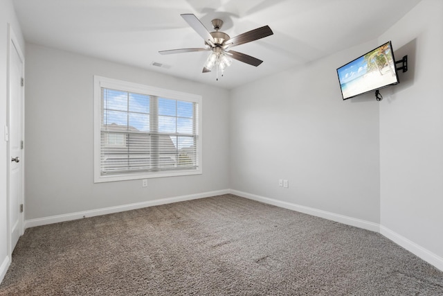 unfurnished bedroom with baseboards, visible vents, ceiling fan, and carpet flooring