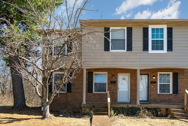 view of front of house featuring brick siding