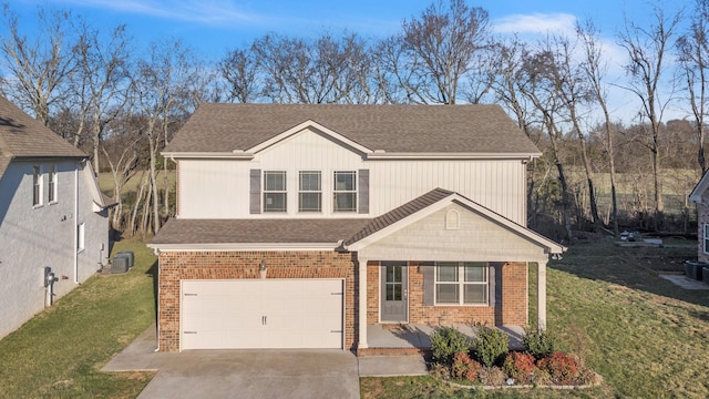 view of front of property with a garage, a front yard, concrete driveway, and brick siding