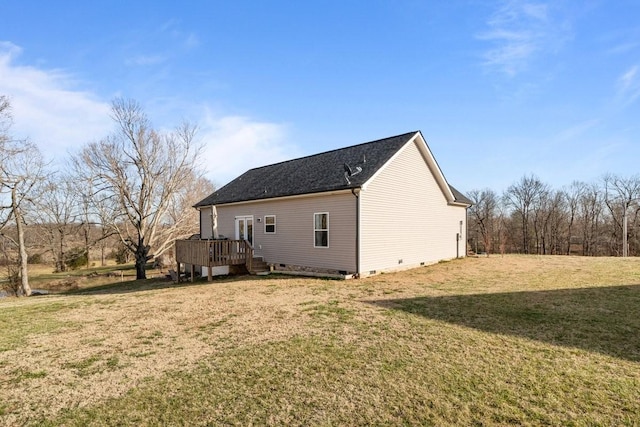 exterior space featuring a shingled roof, crawl space, a lawn, and a wooden deck