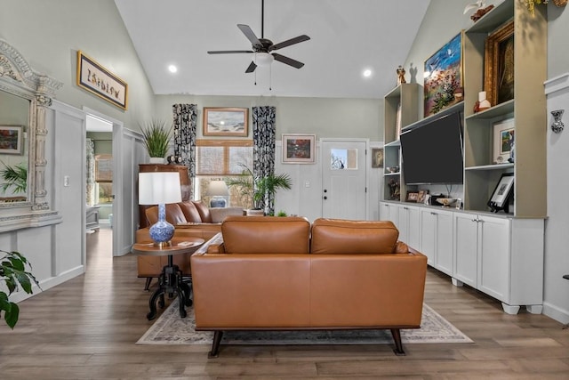 living area with ceiling fan, high vaulted ceiling, wood finished floors, and recessed lighting