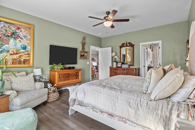 bedroom with a ceiling fan and wood finished floors