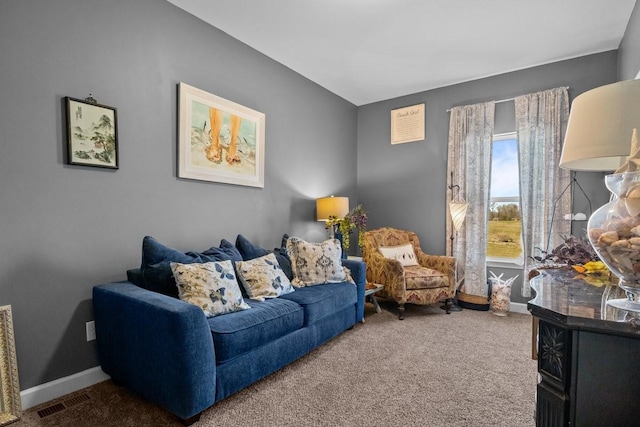 living room featuring carpet flooring and baseboards