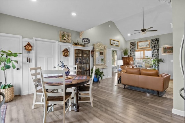 dining area with a ceiling fan, recessed lighting, high vaulted ceiling, and wood finished floors