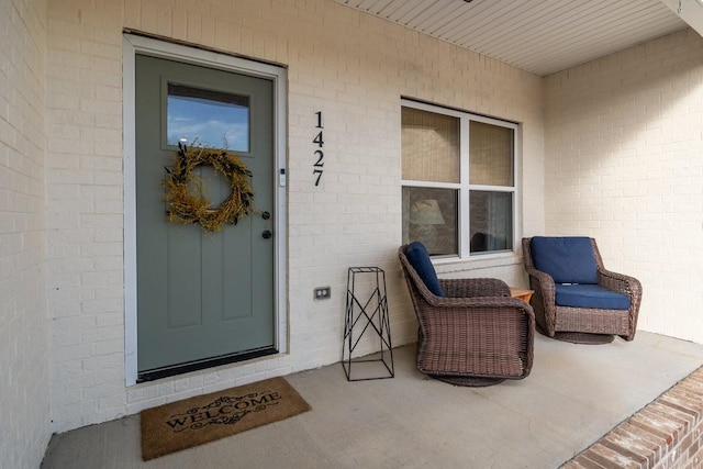 doorway to property with covered porch