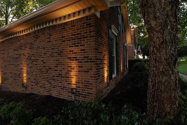 view of property exterior featuring brick siding