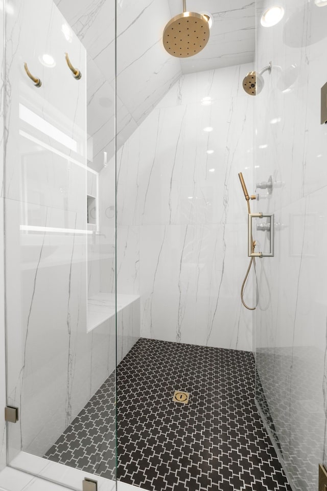 bathroom with a marble finish shower