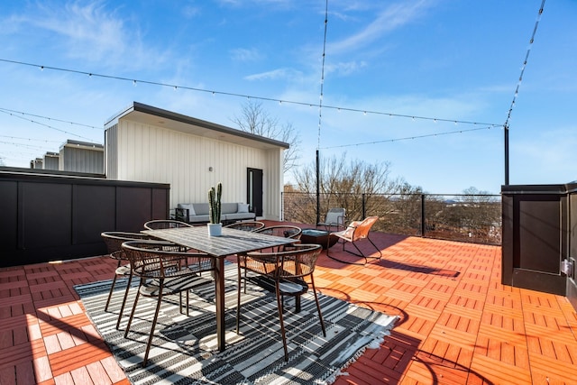 wooden deck with a patio area and outdoor dining area