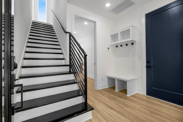 mudroom featuring light wood-type flooring, visible vents, and recessed lighting