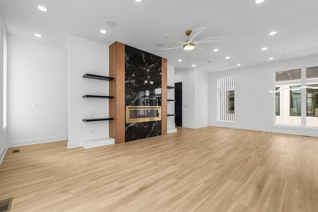 unfurnished living room featuring ceiling fan, recessed lighting, visible vents, and light wood-style floors