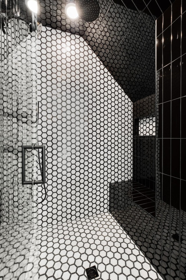 interior space with tiled shower