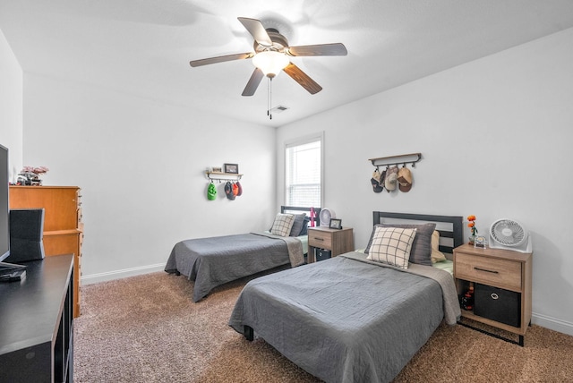 bedroom featuring ceiling fan, carpet, visible vents, and baseboards