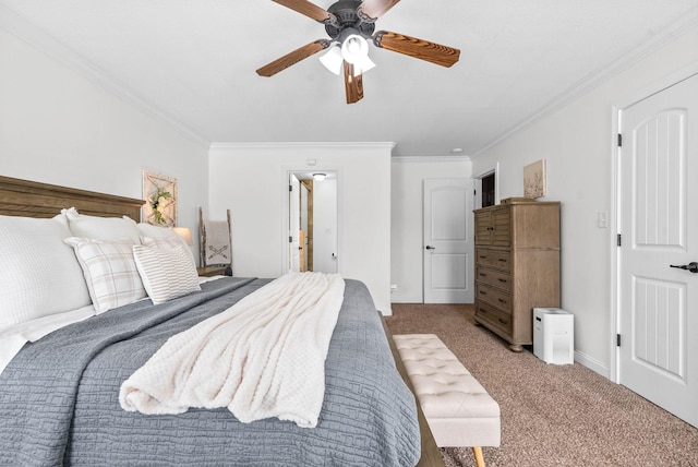 bedroom featuring ornamental molding, carpet, ceiling fan, and baseboards