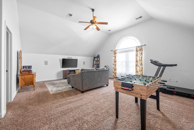 rec room with a ceiling fan, carpet, visible vents, and lofted ceiling