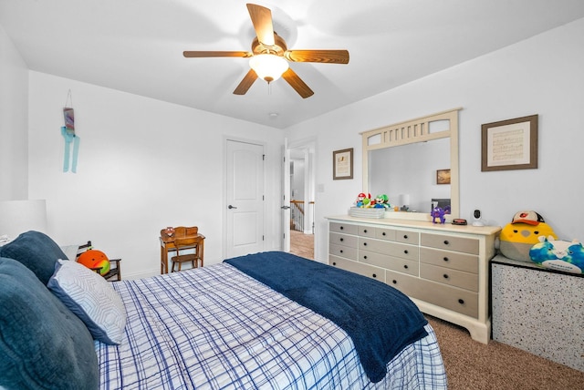 carpeted bedroom with ceiling fan