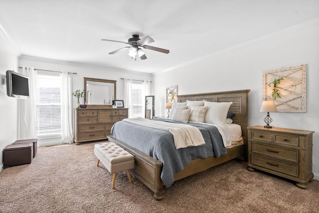 bedroom featuring carpet, ornamental molding, and ceiling fan