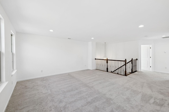 unfurnished room featuring baseboards, carpet flooring, and recessed lighting