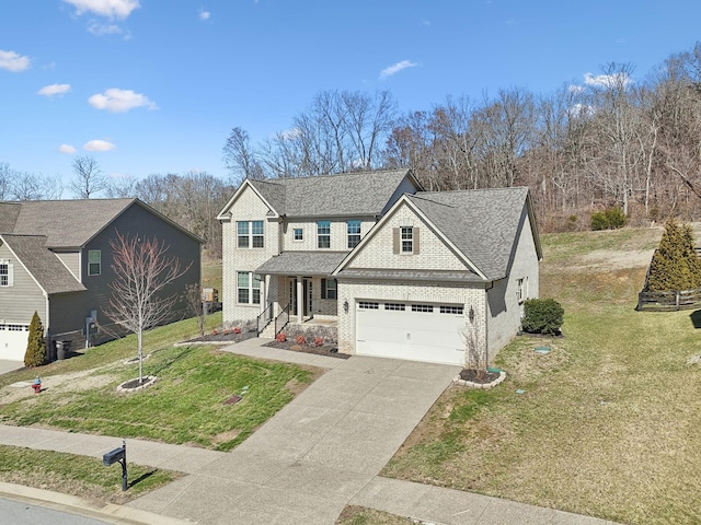 traditional-style home with concrete driveway, roof with shingles, an attached garage, a front lawn, and brick siding