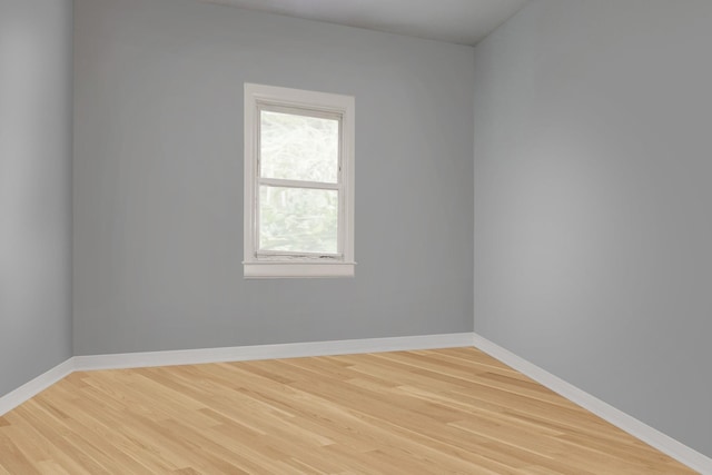 unfurnished room featuring light wood-type flooring and baseboards