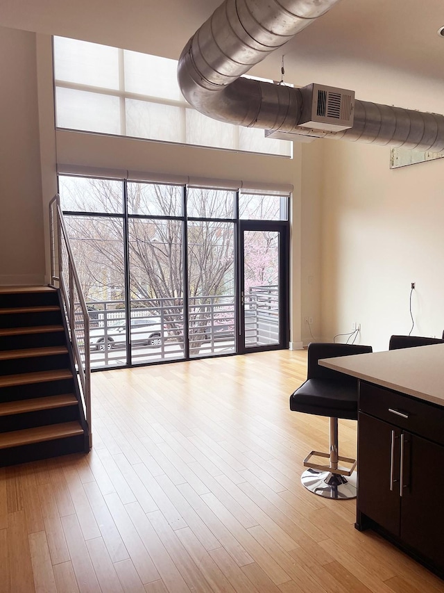 interior space with stairway and wood finished floors