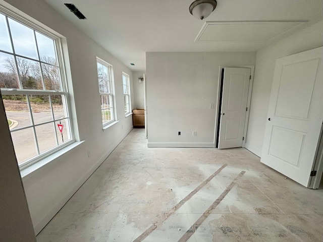 interior space featuring baseboards