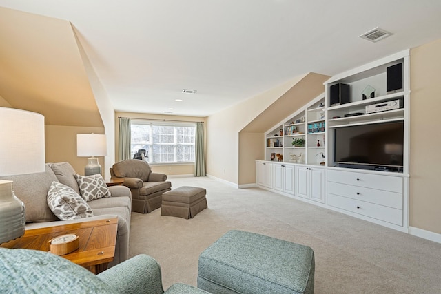 carpeted living room featuring baseboards, visible vents, vaulted ceiling, and built in features