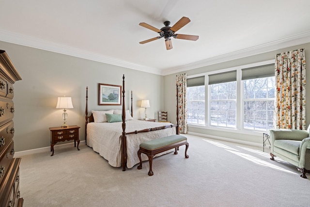 bedroom featuring ornamental molding, light carpet, ceiling fan, and baseboards