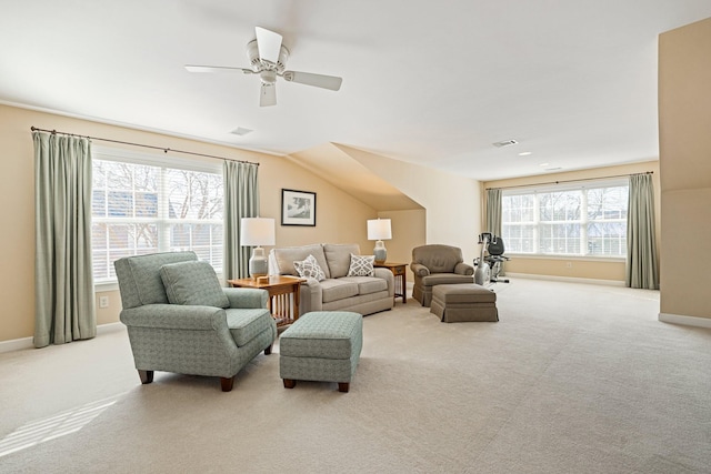 carpeted living room featuring visible vents, baseboards, and ceiling fan