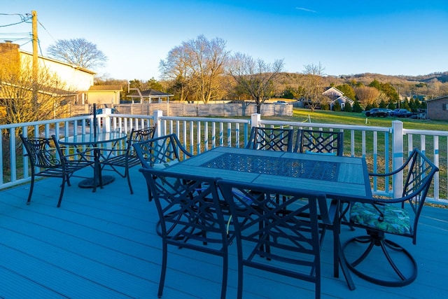 deck featuring outdoor dining area