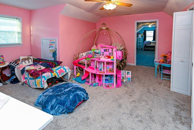 bedroom with a ceiling fan, carpet flooring, and vaulted ceiling