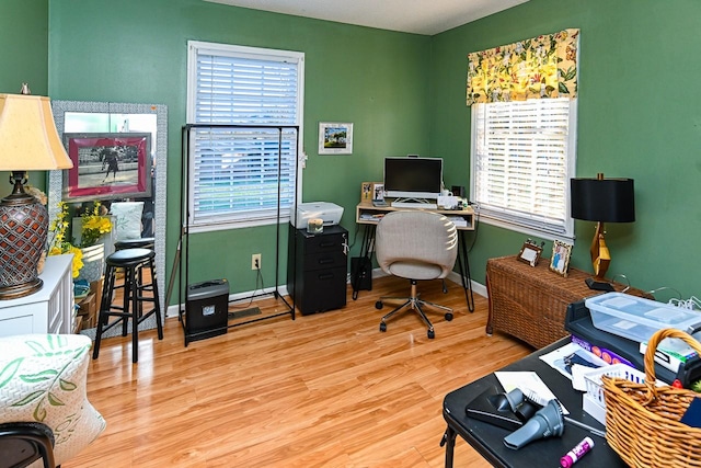 office area featuring baseboards and wood finished floors