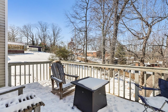 view of snow covered deck