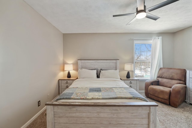 bedroom featuring a textured ceiling, carpet floors, a ceiling fan, and baseboards