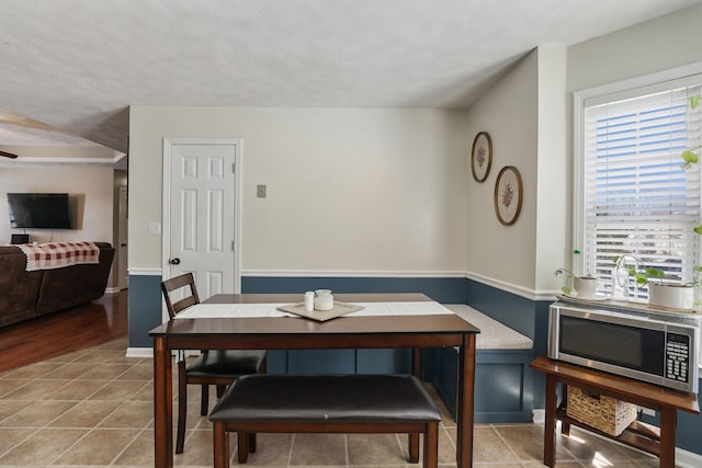 tiled dining room with baseboards