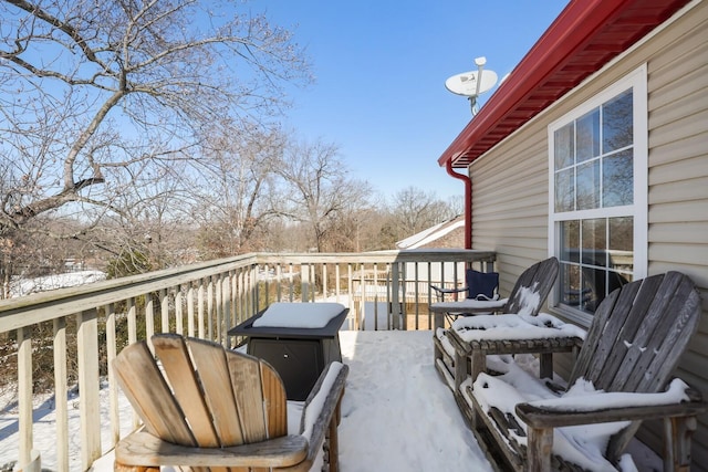 view of snow covered deck