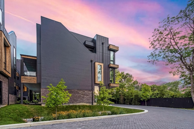 exterior space with stone siding