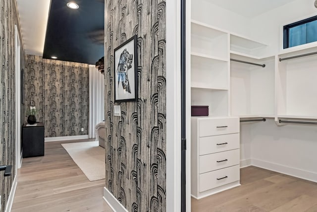 spacious closet with light wood-style floors