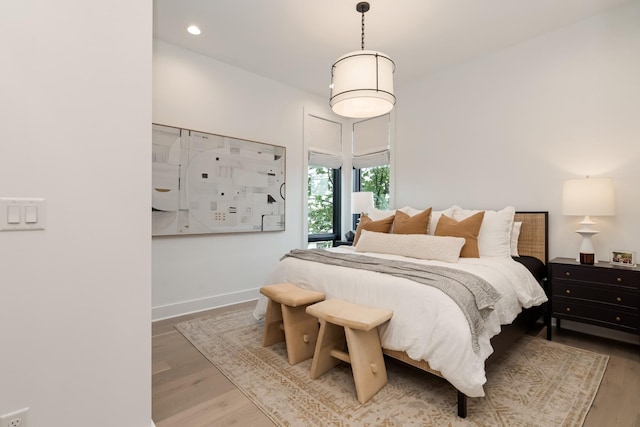 bedroom featuring recessed lighting, baseboards, and wood finished floors