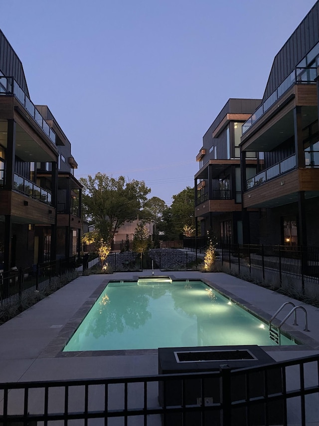 view of swimming pool with fence and a fenced in pool