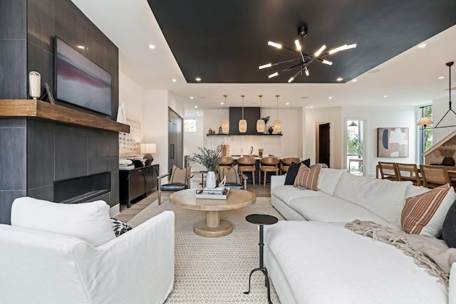 living room with an inviting chandelier and recessed lighting