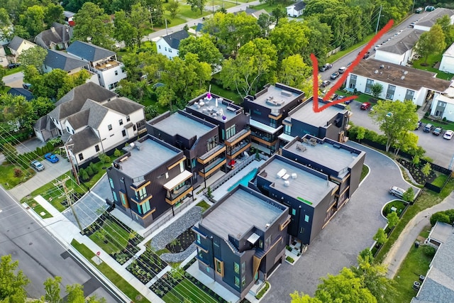 birds eye view of property with a residential view