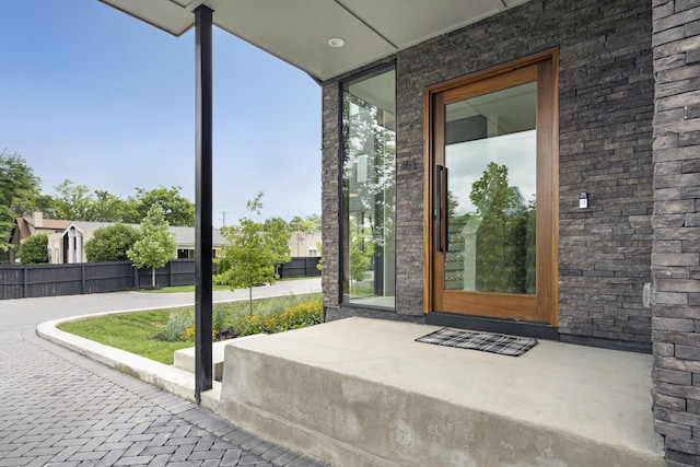 property entrance with fence