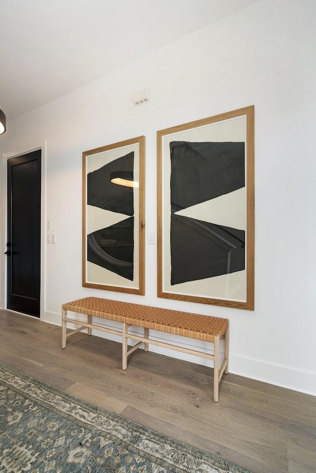 interior details featuring wood finished floors and baseboards