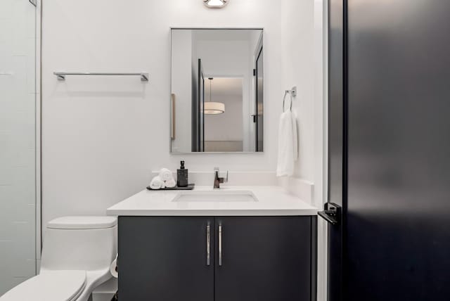 bathroom with vanity and toilet