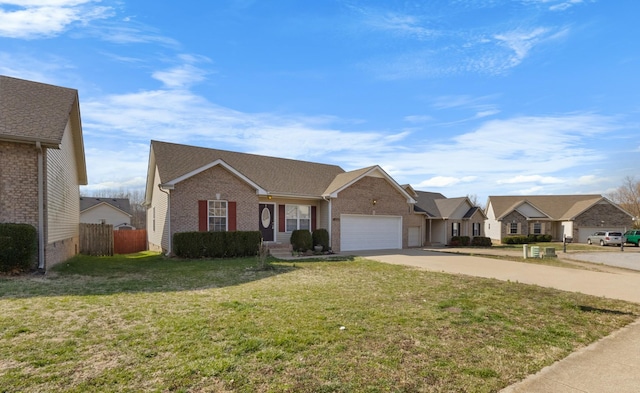 single story home featuring brick siding, a front lawn, fence, concrete driveway, and a garage