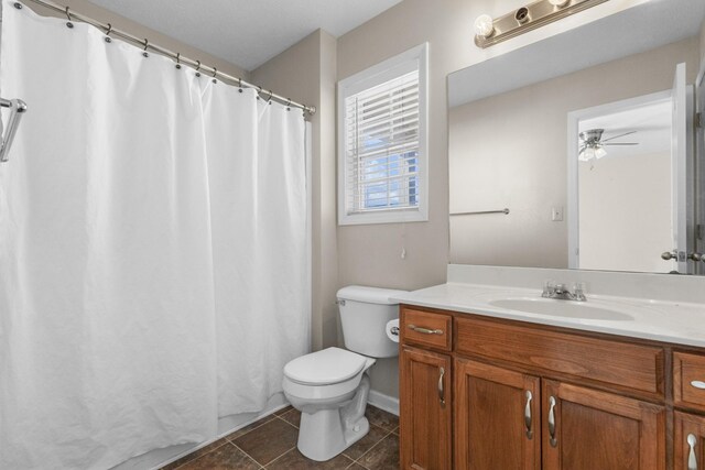 full bath featuring vanity, a shower with curtain, ceiling fan, tile patterned flooring, and toilet