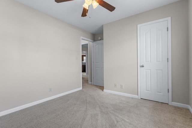 unfurnished bedroom with baseboards, carpet floors, and ceiling fan