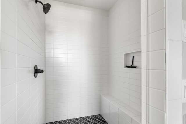 bathroom with a tile shower