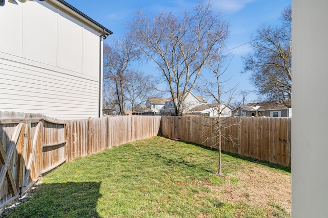 view of yard with a fenced backyard