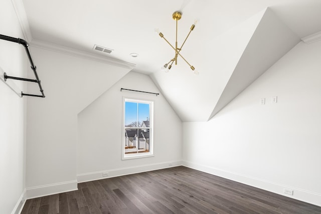 bonus room with lofted ceiling, dark wood-style floors, baseboards, and visible vents